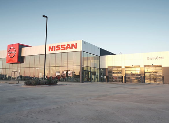 Angled exterior view of a Nissan dealership